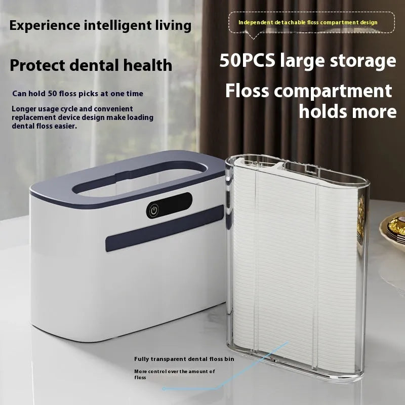 Automatic rechargeable dental floss box in dark grey, gold, and light grey colours with floss refill