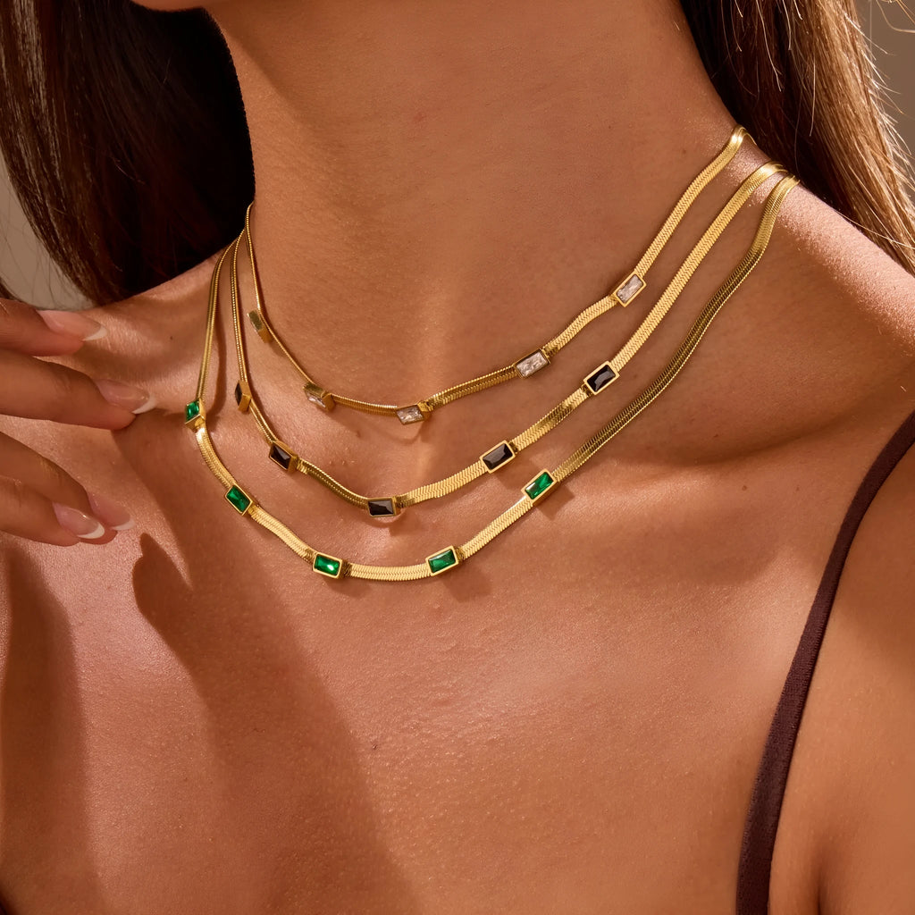 Geometric square zircon necklace in stainless steel with electroplated gold finish showing quadrilateral pattern