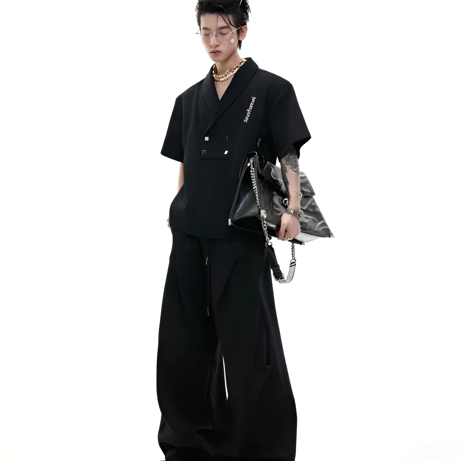 Men's dark grey cotton V-neck sports suit with padded shoulders, metal details, and matching shorts.