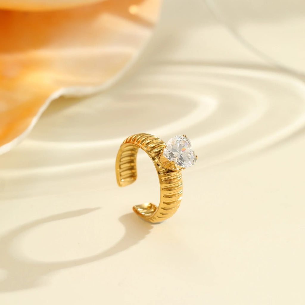 Gold plated adjustable ring with zircon stones in a geometric heart and drop shape design