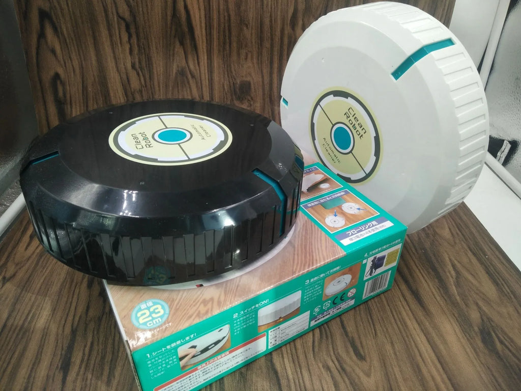 Black and white AC robot vacuum cleaner on wooden floor