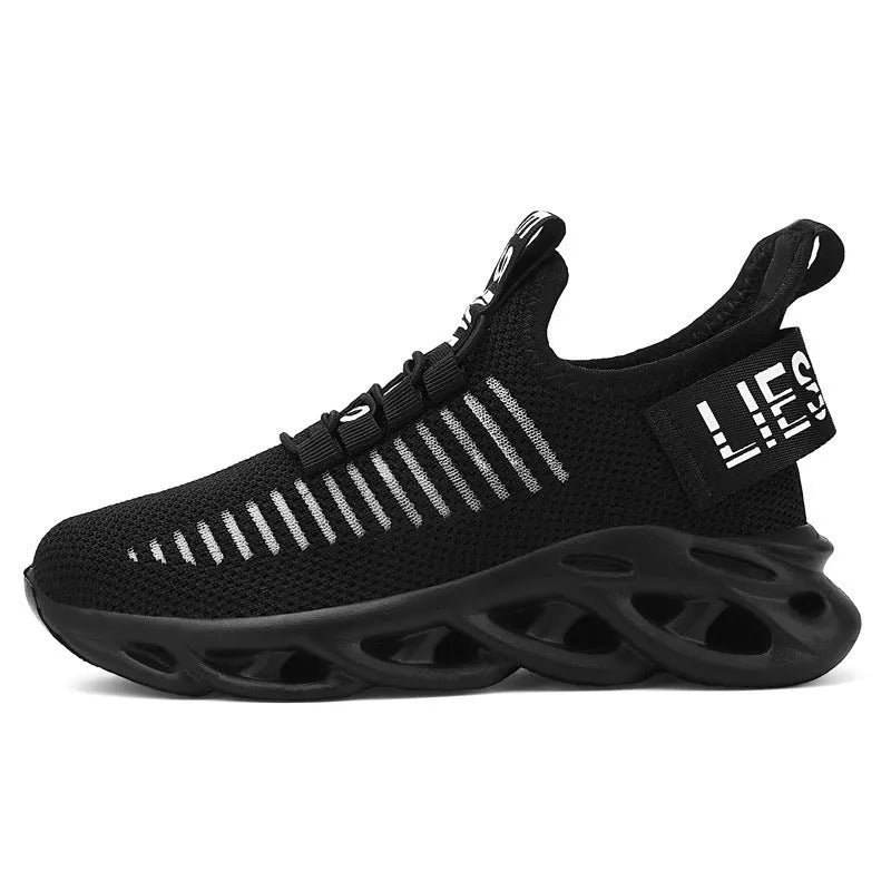 Children's Velcro sneakers in black, khaki, or white with fabric upper and textured sole.