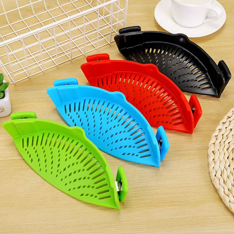 Silicone clip-on funnel colander in kitchen draining liquid from pot