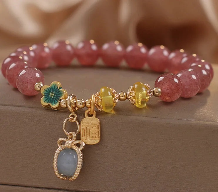Red women's bracelet with strawberry quartz beads, alloy components, and rhinestones