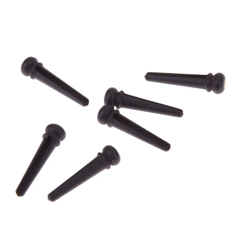 Set of six matt black ebony guitar string nails for folk acoustic instruments