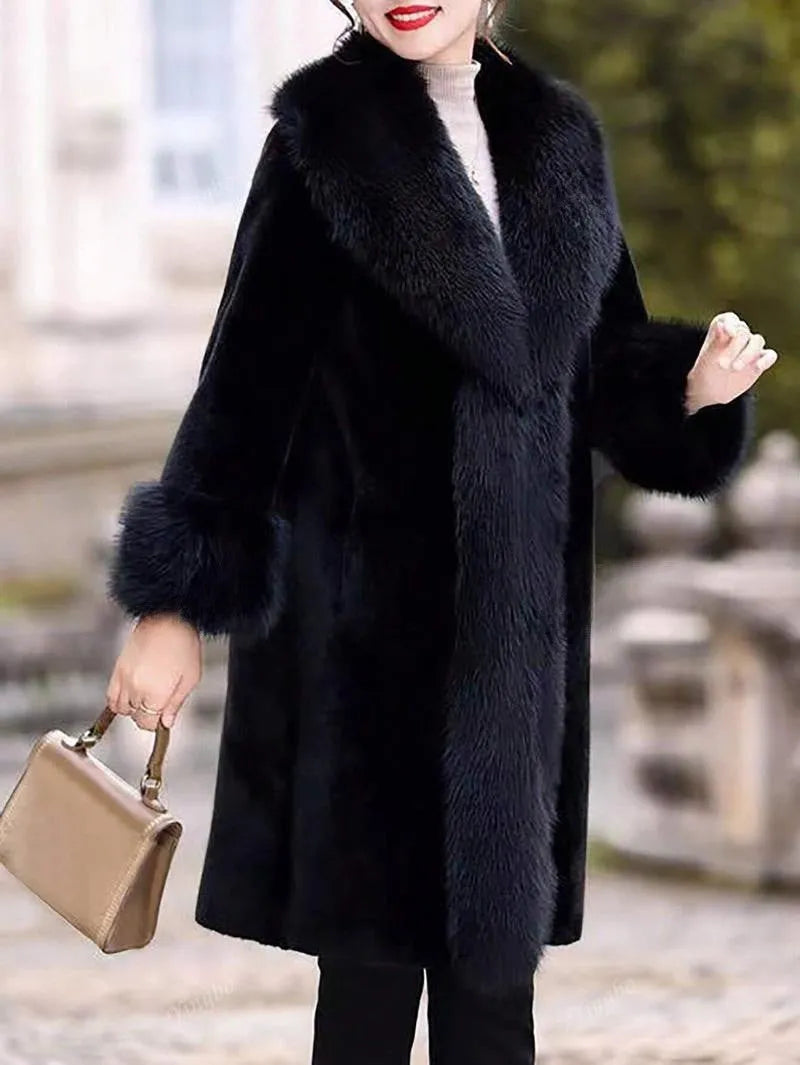 Grey women's mid-length faux rabbit fur coat with a fur collar, shown on a hanger.