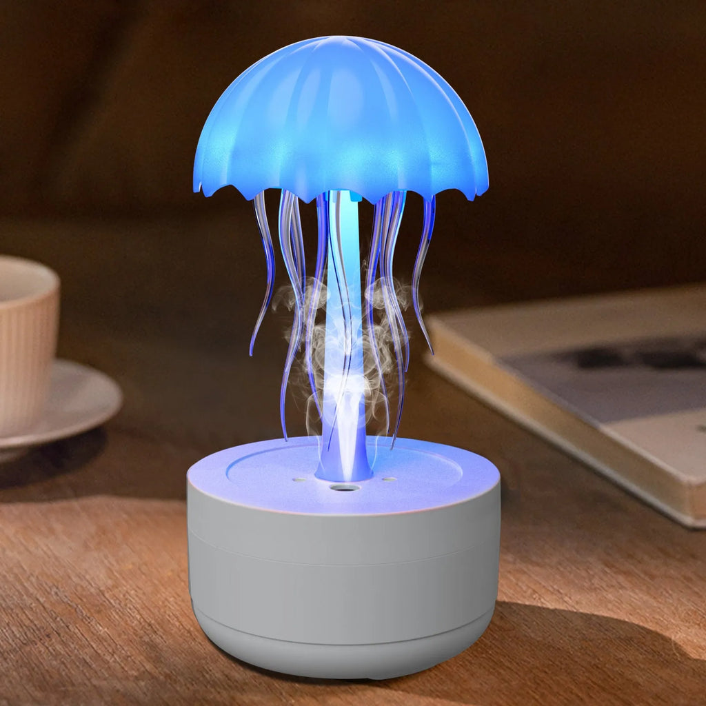 White jellyfish-shaped humidifier and essential oil diffuser with colourful LED lights on a desk.