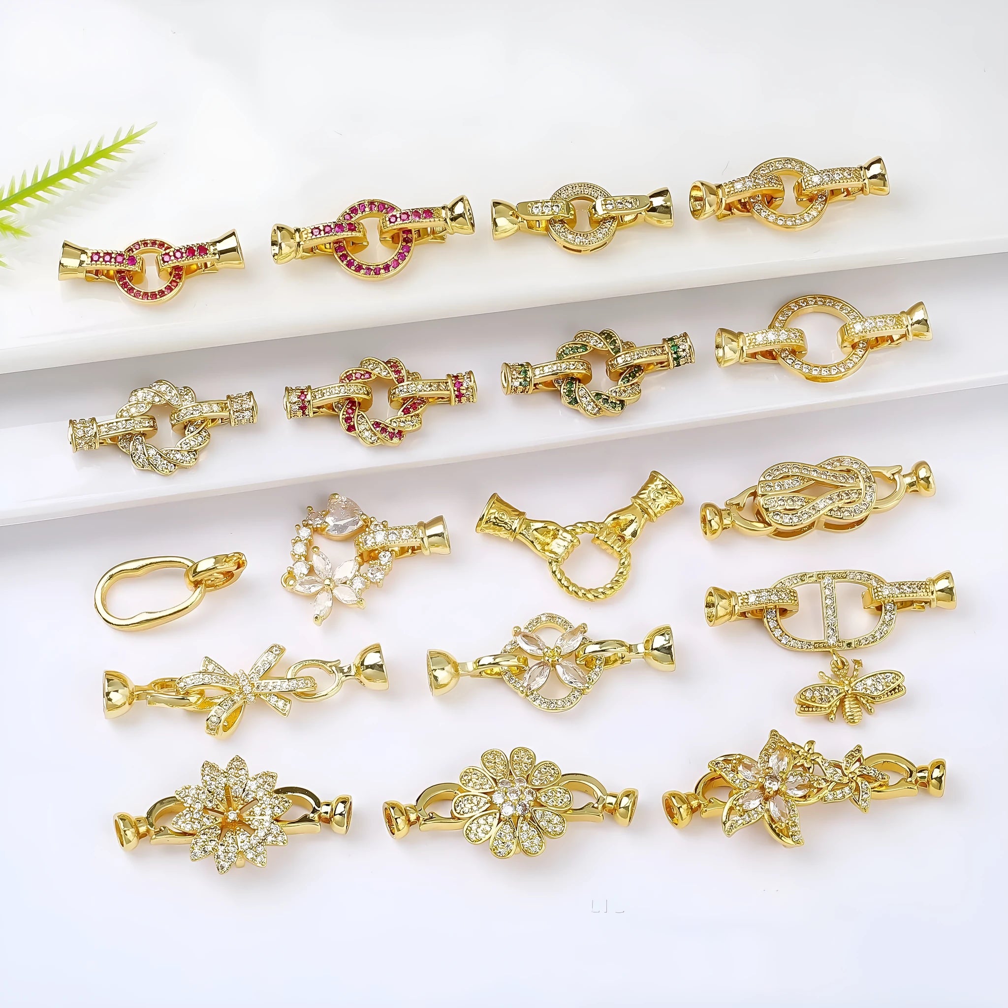 Small gold-coloured jewellery clasp with pearl detail for DIY necklace making