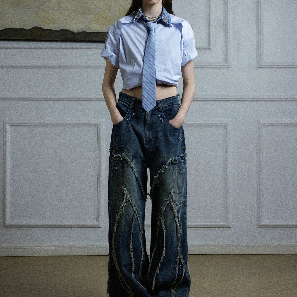Men's blue and khaki patchwork striped shirt with diamond tie and quilted details, showing loose fit and flip collar.