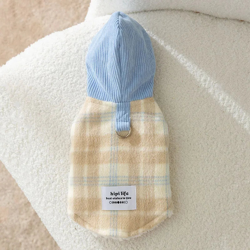 Blue corduroy dog vest with a chessboard grid pattern and an attached yellow hood.