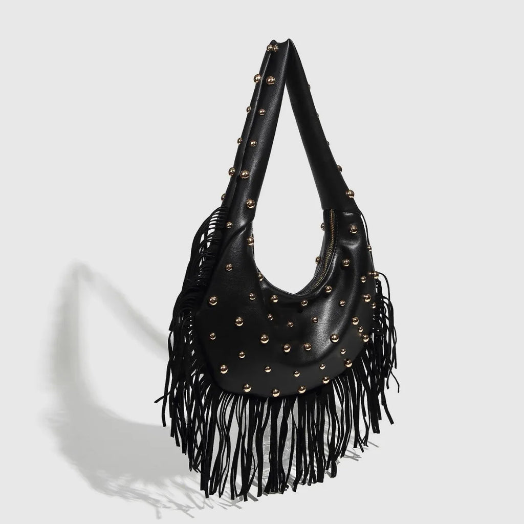 Retro black shoulder handbag with tassel detail and internal mobile phone pocket.