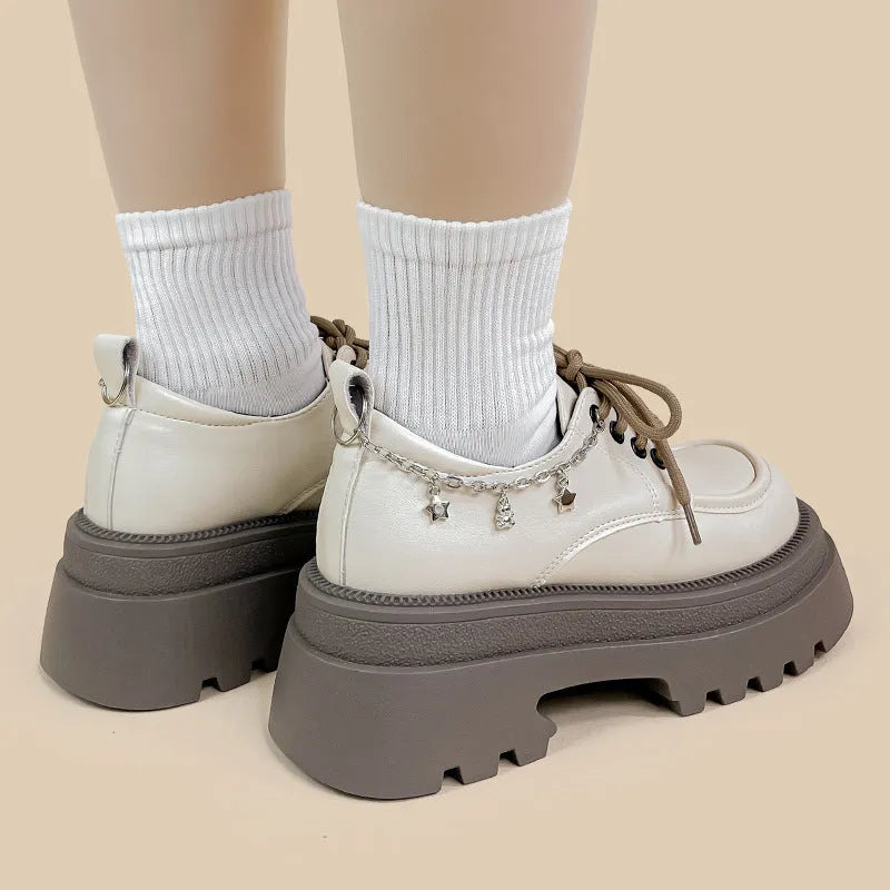 White women's platform leather shoes with chunky heel and front lace-up, round toe.