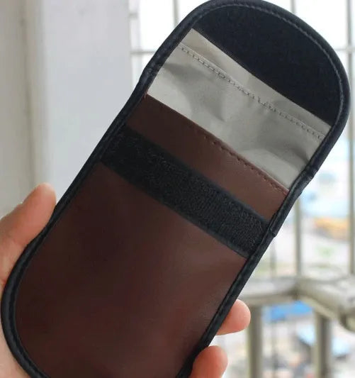 Black microfiber Faraday pouch for car key fobs and RFID cards, measuring 13.5 cm.