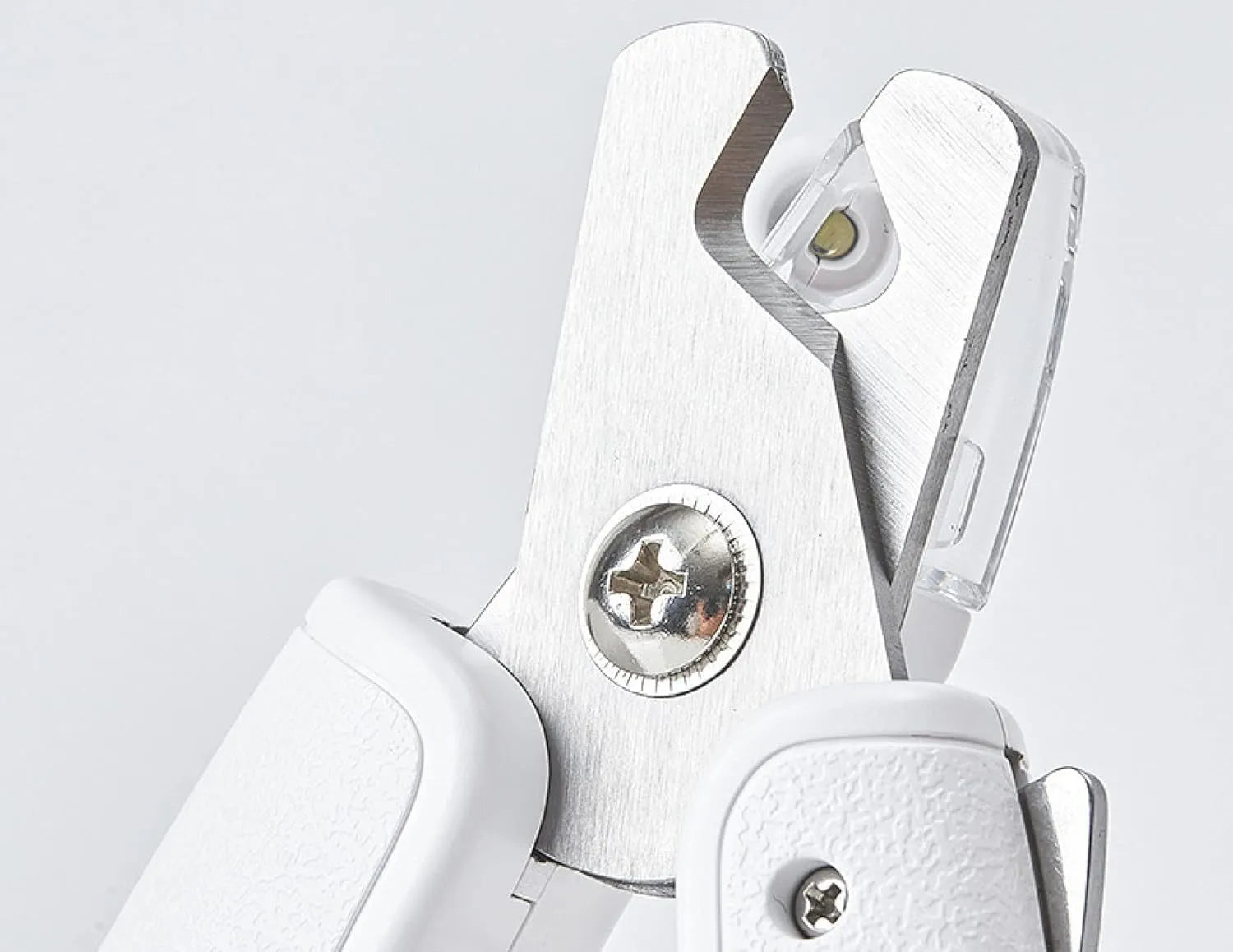 White LED pet nail clipper with a transparent anti-splash guard and a nail file on a white background.
