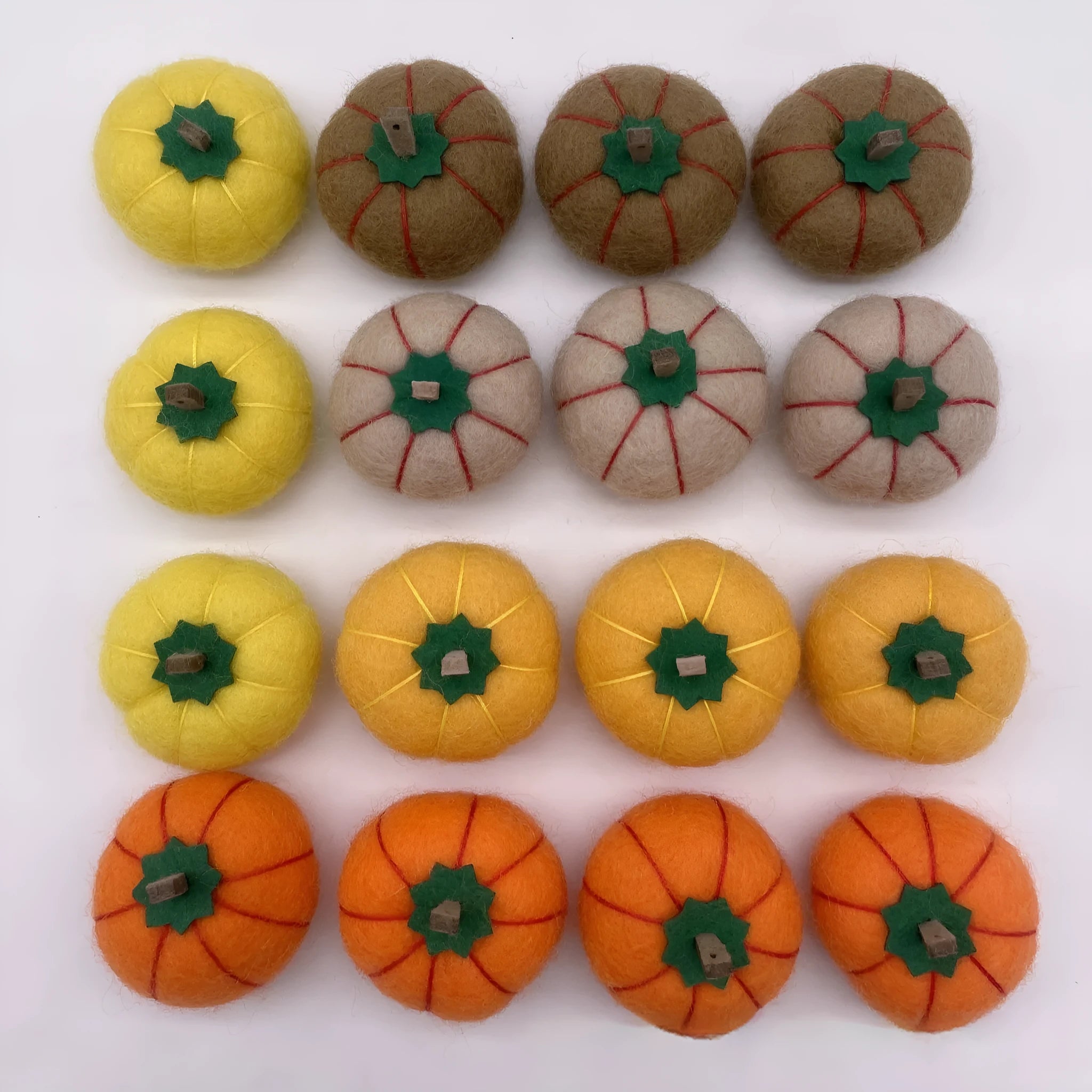 Wool felt pumpkin ornament measuring 5cm diameter in autumn colours for miniature displays