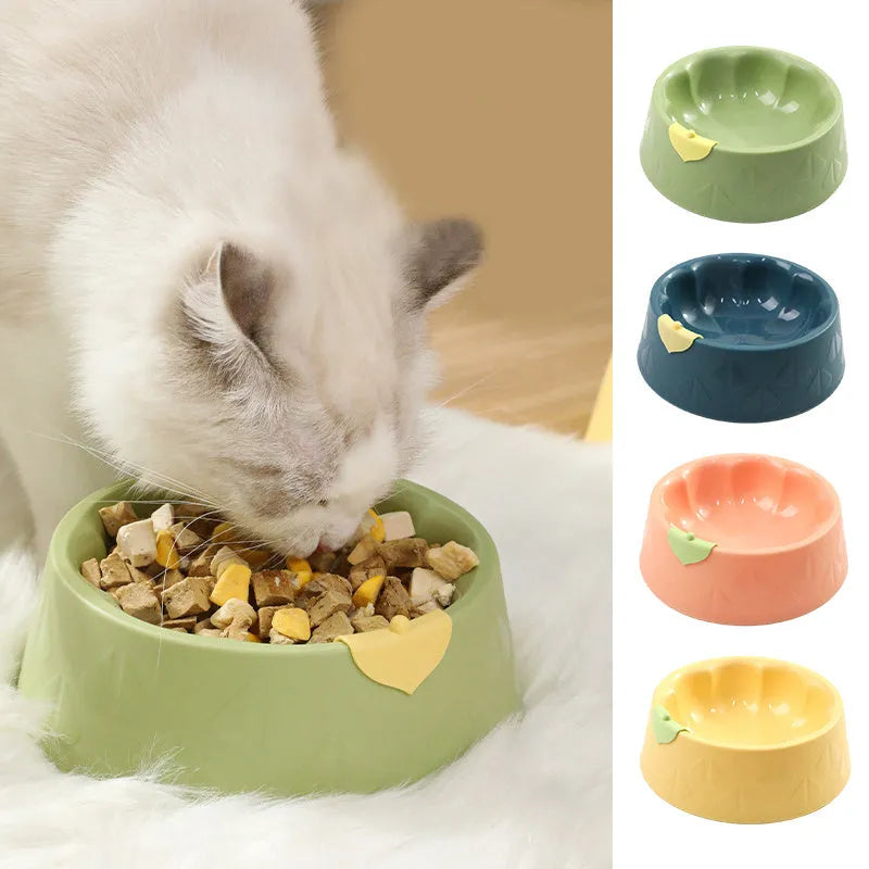 Green plastic double bowl for dog and cat food and water with anti-tip base.