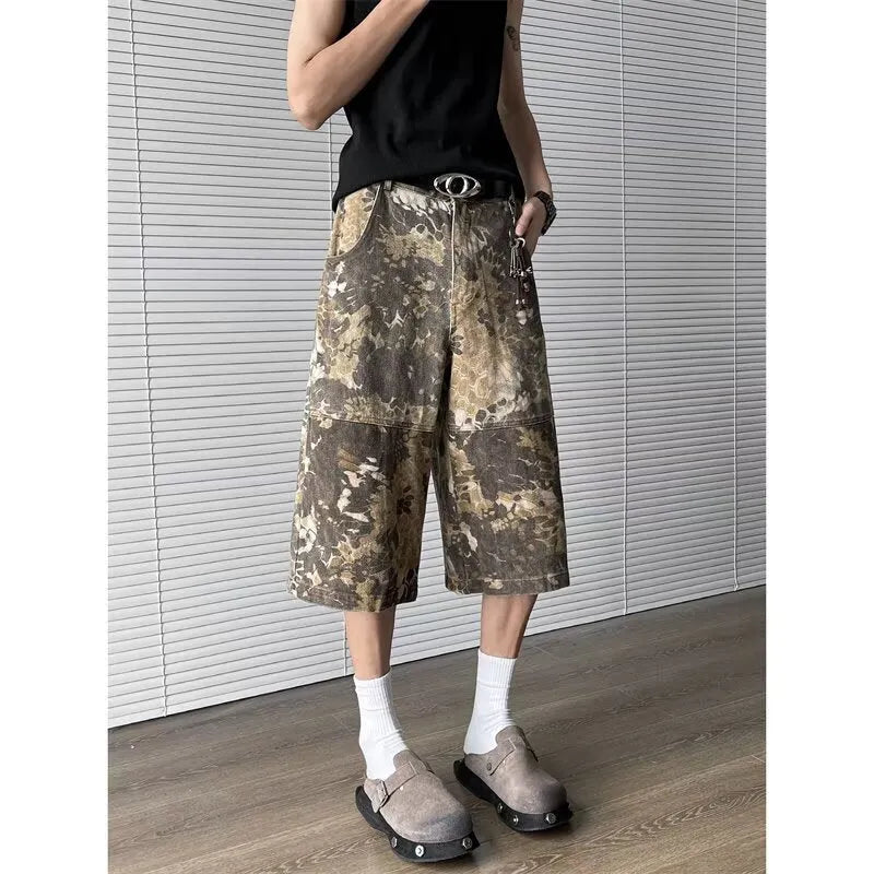 Yellow women's jeans with snake camouflage print, cropped length, and high waist.