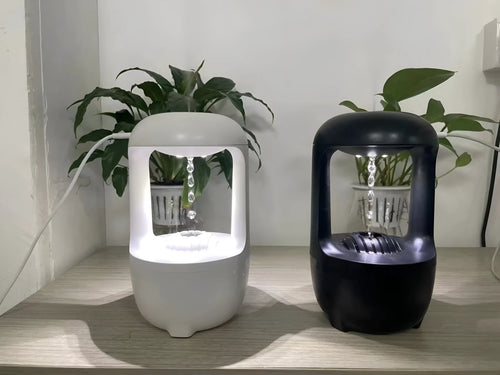 Black and white anti-gravity humidifier with floating water drops and large 500ml water tank.