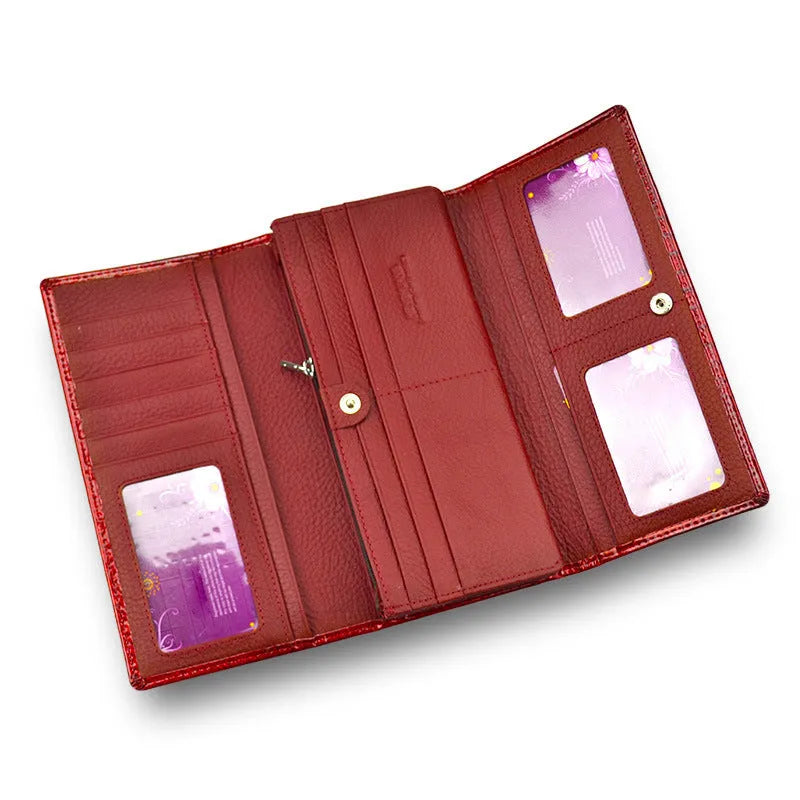 Women's leather coin purse with crocodile pattern embossing in red colour showing interior pigskin lining