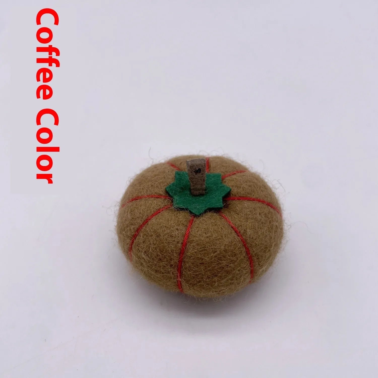 Wool felt pumpkin ornament measuring 5cm diameter in autumn colours for miniature displays