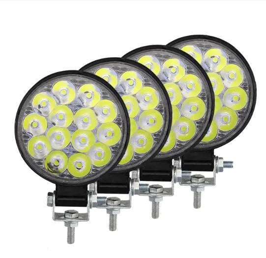 White mini round 42W LED work light with aluminium housing for vehicle mounting.