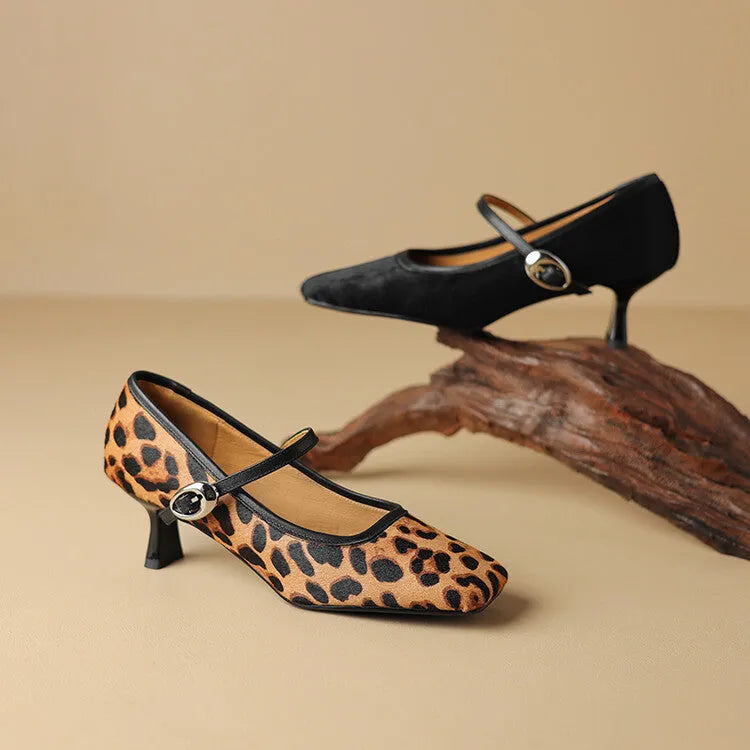 Women's black square toe stiletto ankle-strap shoes with horse hair upper and buckle closure.