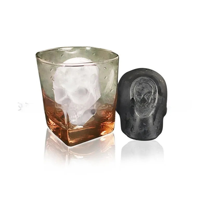 3D Halloween skull-shaped silicone ice cube tray on a table.