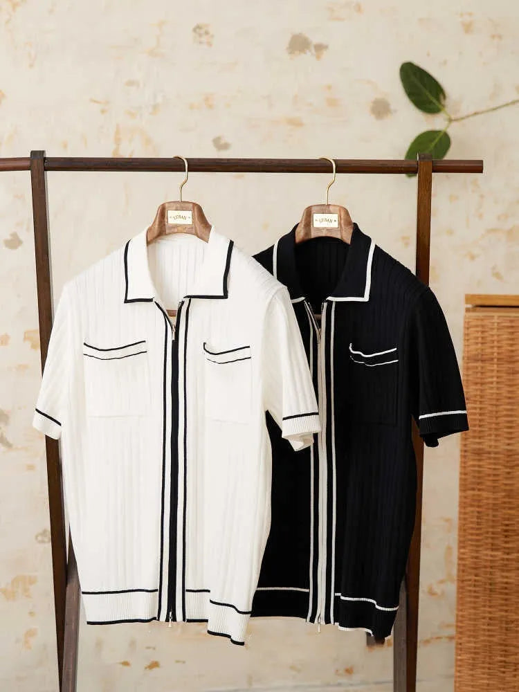 Man's black slim fit polo shirt with a lapel collar and short sleeves.