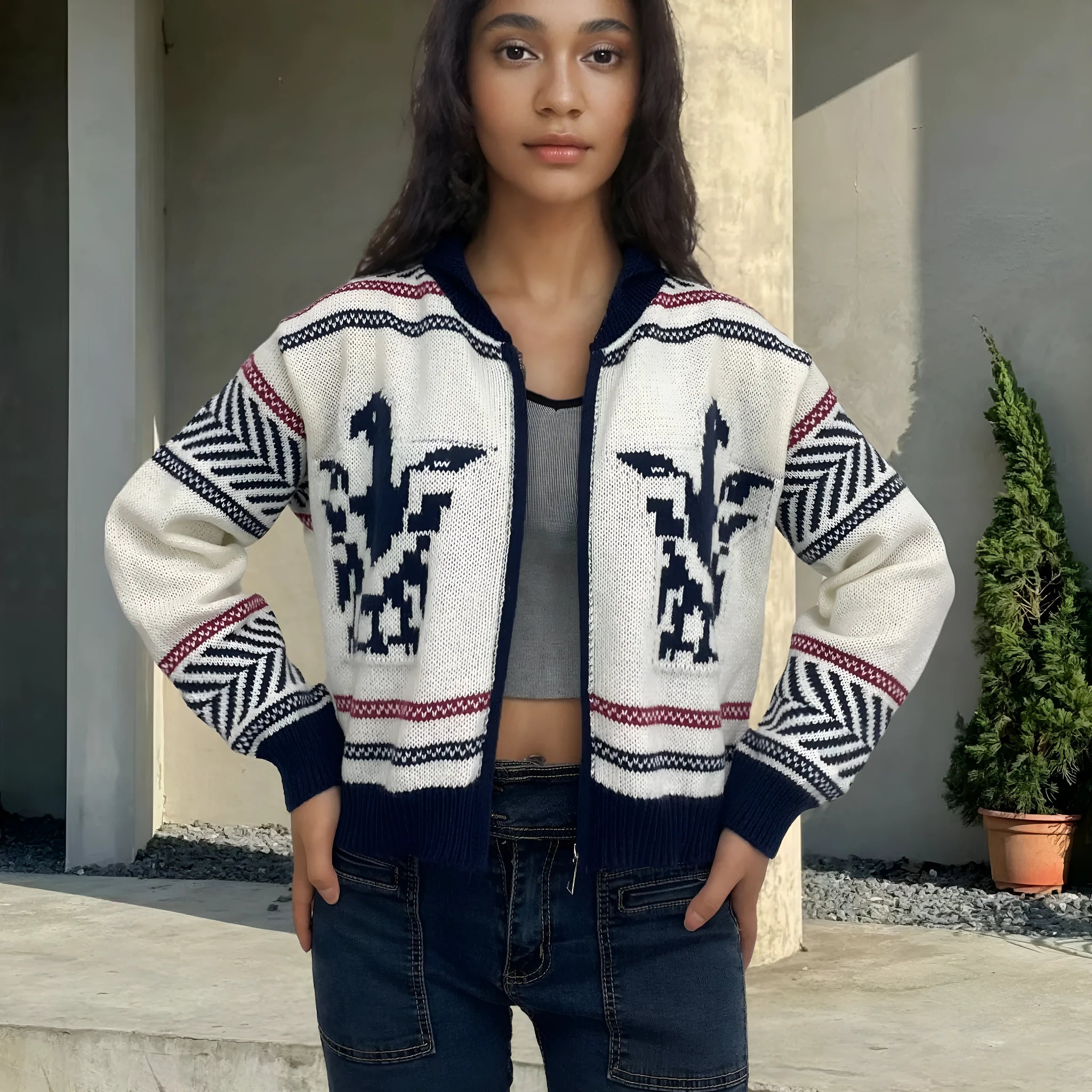White women's cardigan with contrast stripe pattern, lapel collar, and a full-length front zipper.