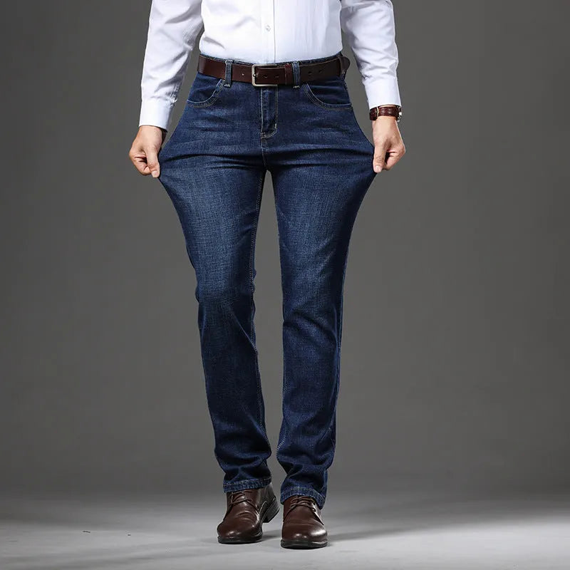 Black and blue loose fit stretch jeans straight-leg trousers on a hanger