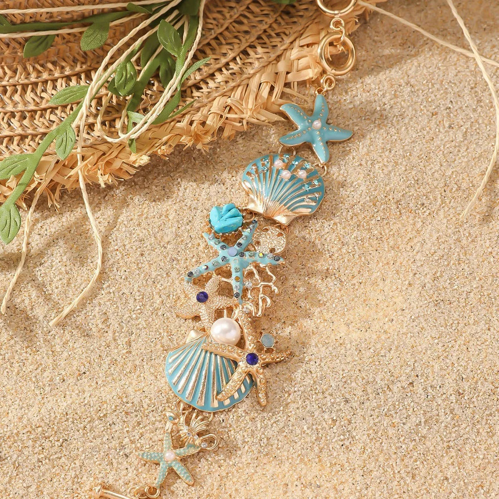 Women's alloy rhinestone marine shell and anchor bracelet with starfish charm in turquoise colour.