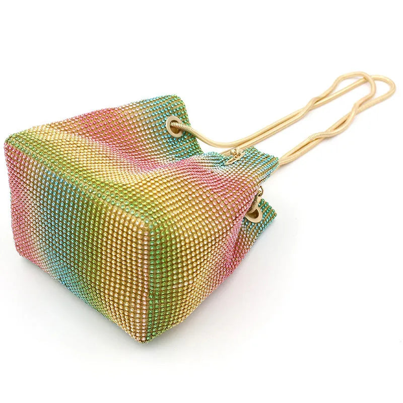 Soft multicolour rhinestone bucket bag with drawstring closure for evening wear.