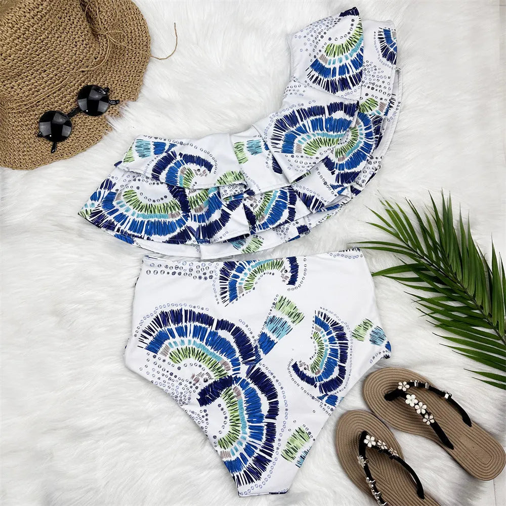 White women's one-shoulder bikini with lotus leaf detail and high-leg split design
