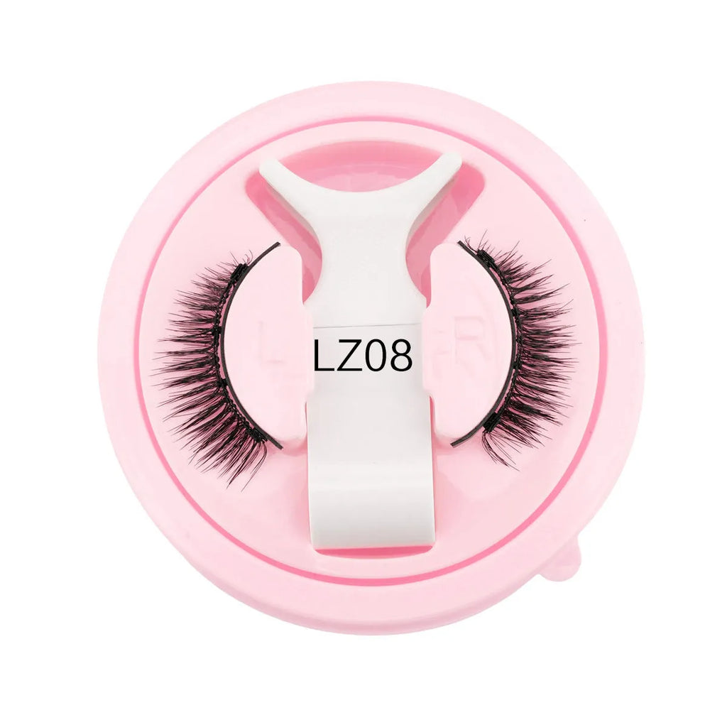 Set of reusable waterproof false eyelashes with thick artificial fibre strands and a flexible glue-free band.
