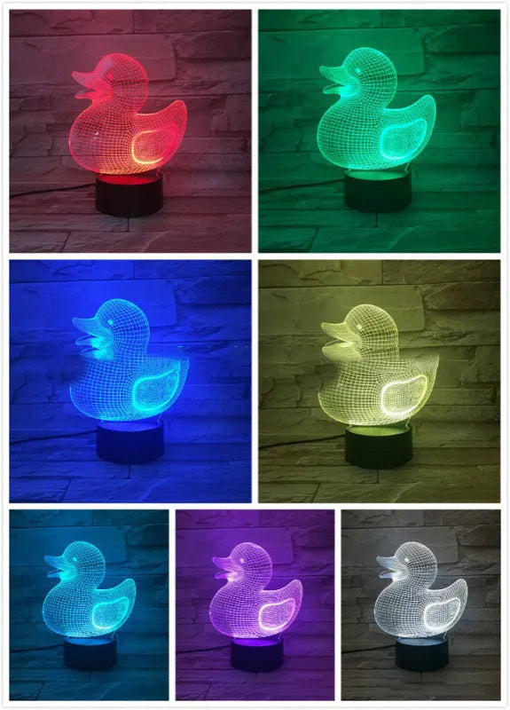 Little yellow duck 3D LED night light showing colour change modes on a desktop