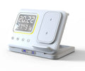 Black foldable wireless charging station displaying time and temperature, charging a phone and smartwatch.