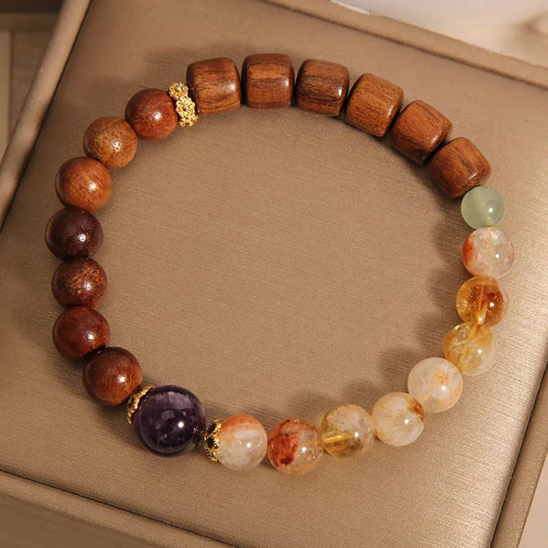 Women's crystal bracelet with yellow tower crystal and ebony amethyst beads featuring pearl and rhinestone accents