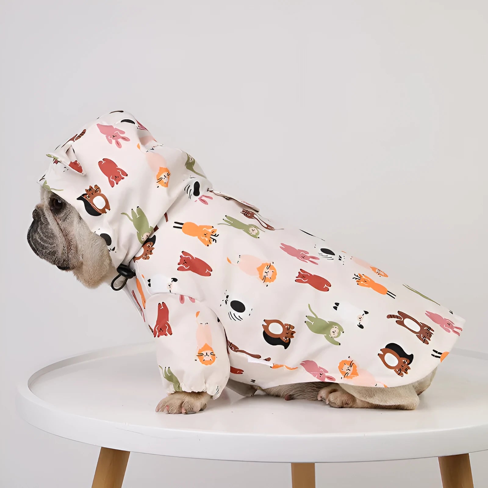 Beige cartoon print dog raincoat with double waterproof PU coating shown on a model dog.