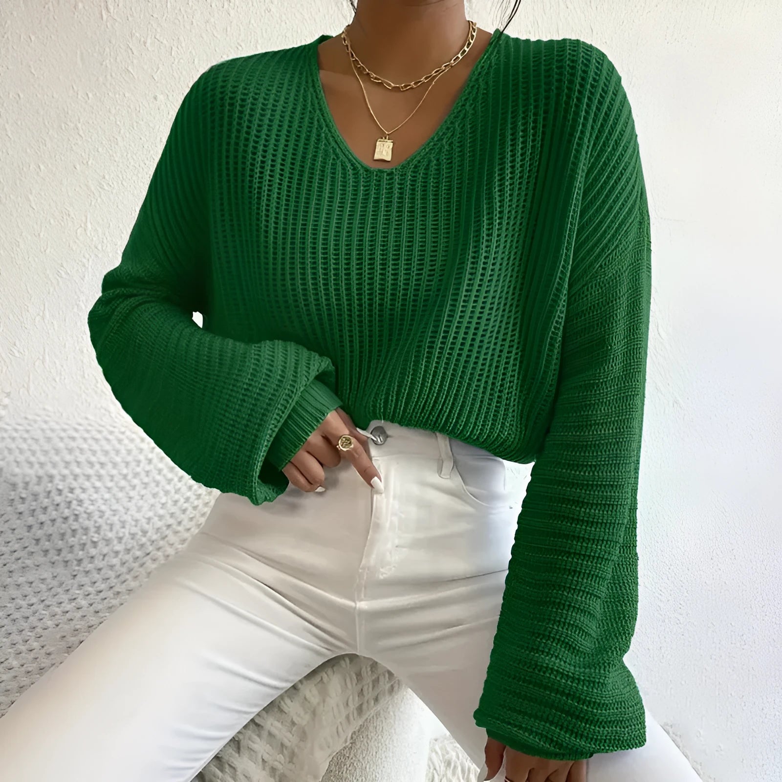 Women's solid colour long sleeve pullover in a loose casual style, shown in one of five available colours.