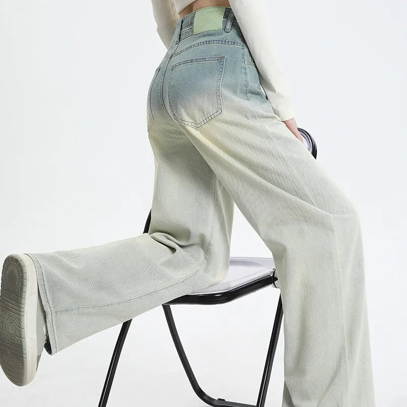 Women's gradient blue straight-leg denim trousers with wide-leg cut on hanger