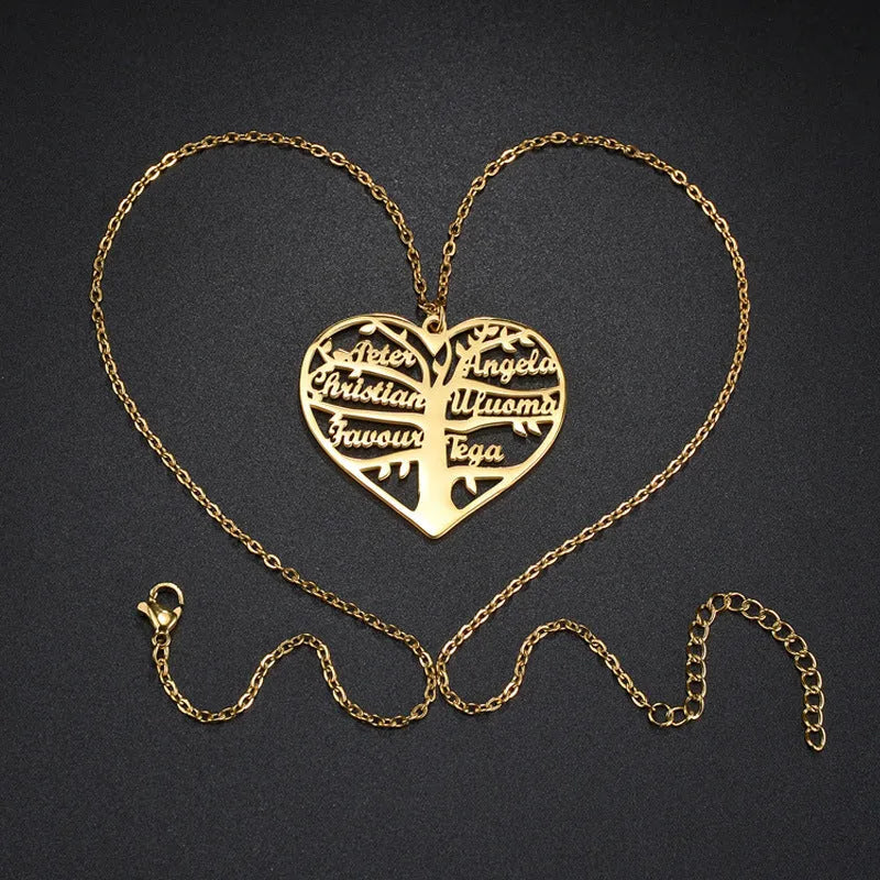 Close-up of a personalised stainless steel necklace with a heart-shaped pendant engraved with names and a family tree design.