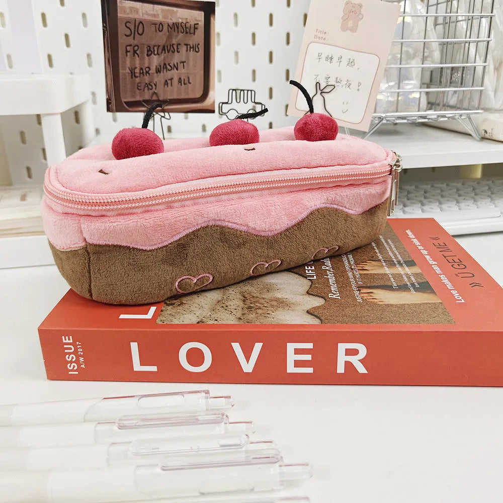 Korean style velvet pencil case with red and pink cherry cake plush design.