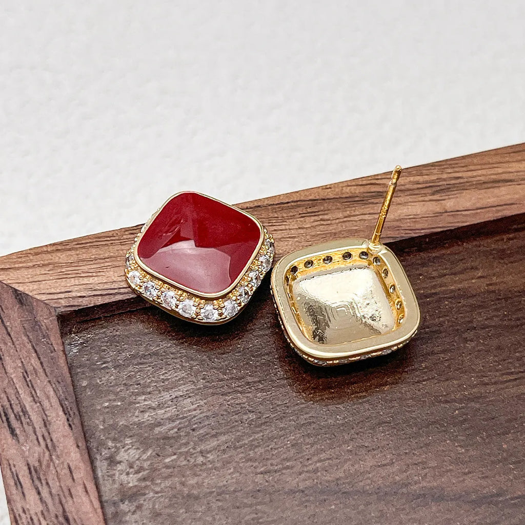 Red square-shaped alloy earrings for women with geometric design and Seiko-treated finish.