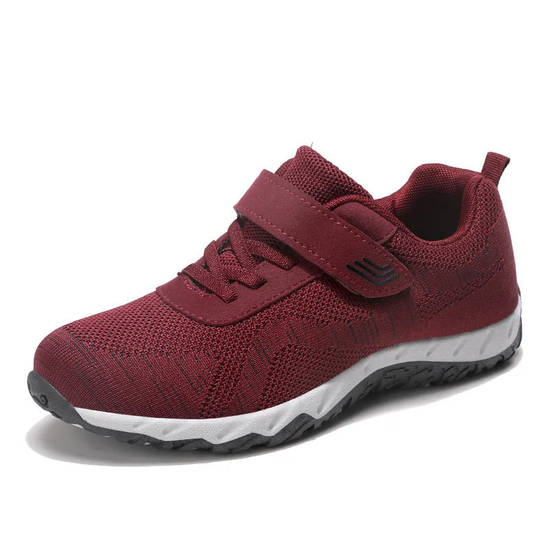 Women's low-top wedge heel shoe in mesh with Velcro strap, shown in a solid colour.