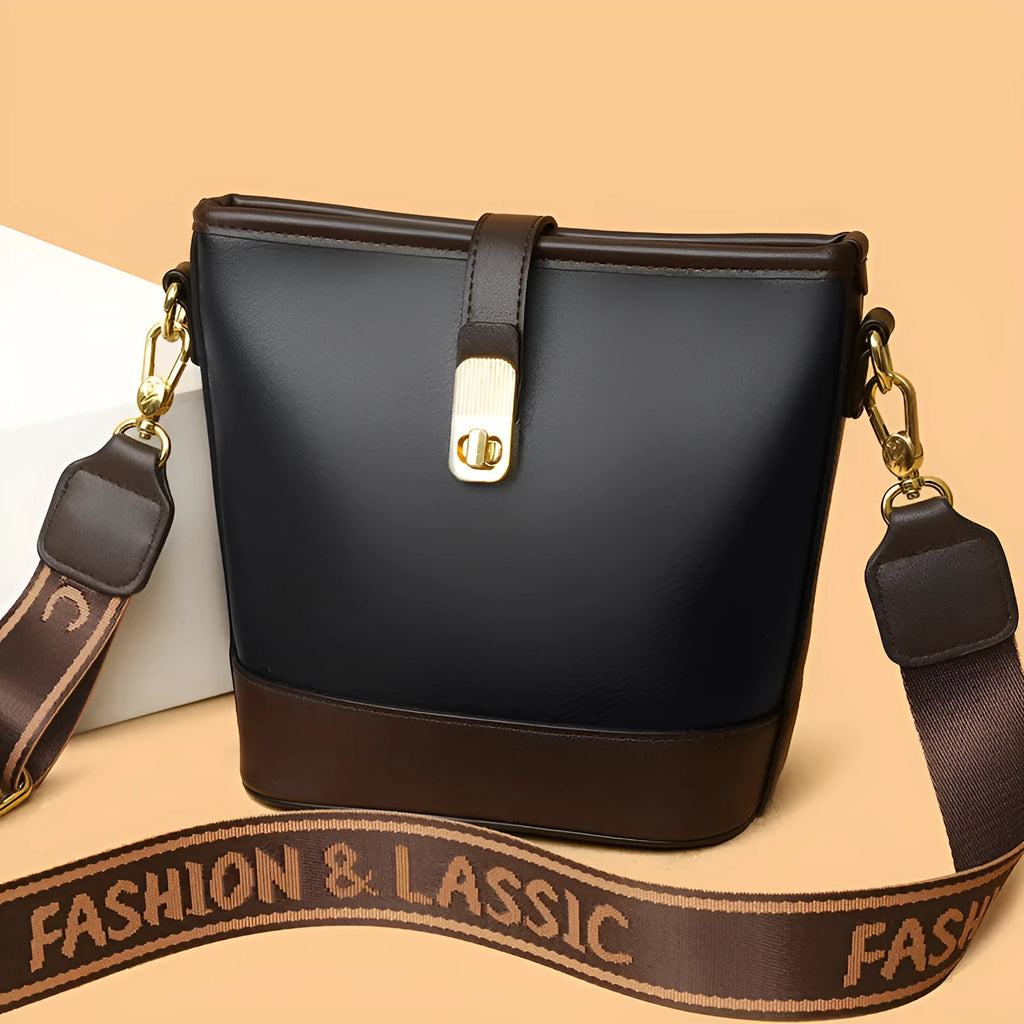 Black PU leather bucket bag with double shoulder straps showing internal compartments and external pocket