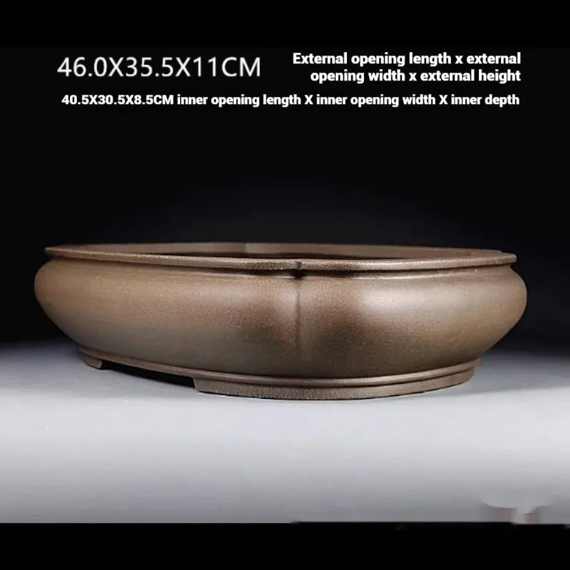 Handmade antique papaya-shaped purple clay flower pot measuring 46cm long by 35.5cm wide.