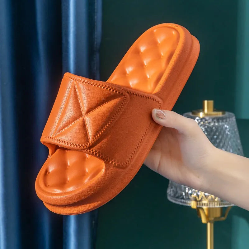 A pair of thick-soled EVA bathroom slippers in a chosen colour, showing the non-slip sole pattern.
