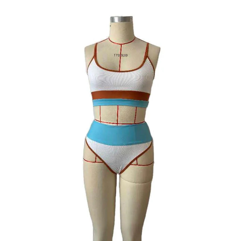 Women's solid colour two-piece swimsuit with a top and shorts for swimming.