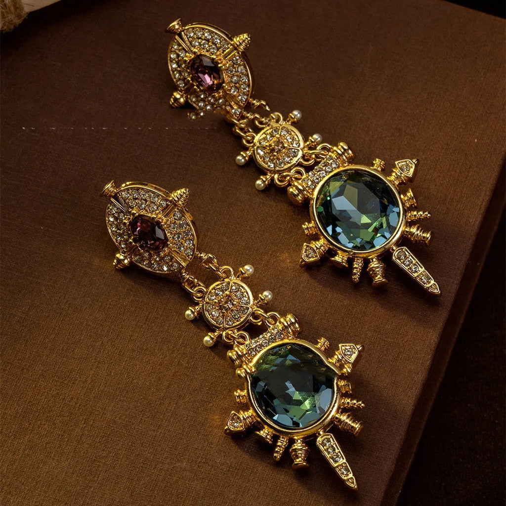 Geometric round gold-coloured stud earrings with diamond-treated alloy surface and retro elegant design