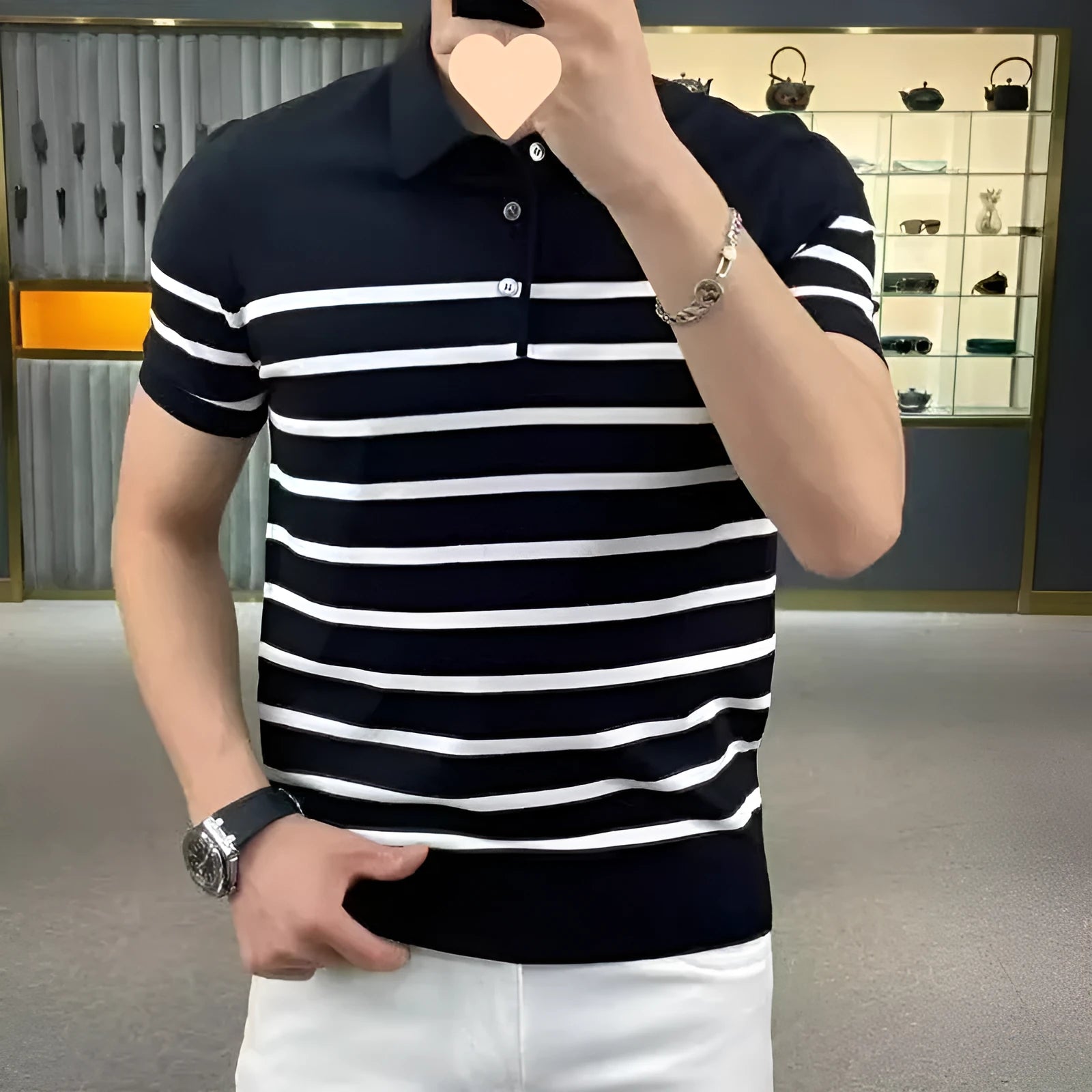 Black and white striped knitted T-shirt with a lapel collar, shown as a pullover.